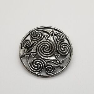 Miracle silver tone brooch with swirls